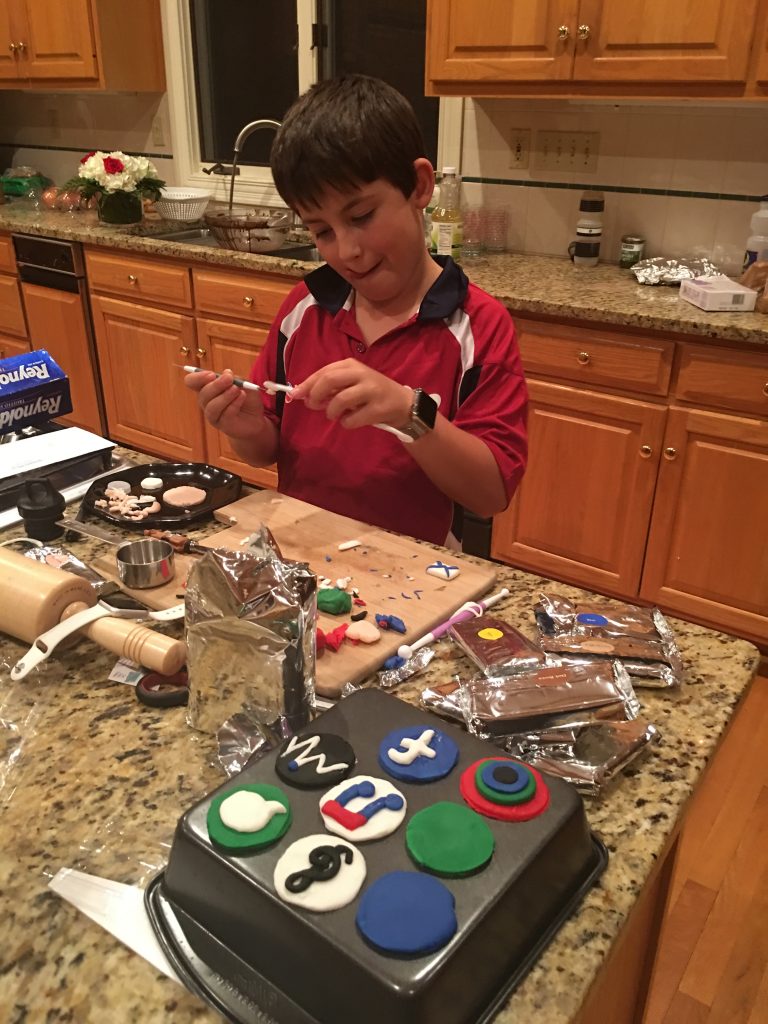 adam-helping-make-an-Apple-Watch-Birthday-Cake