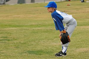 A young baseball player, suffering from Little Leaguer's Elbow